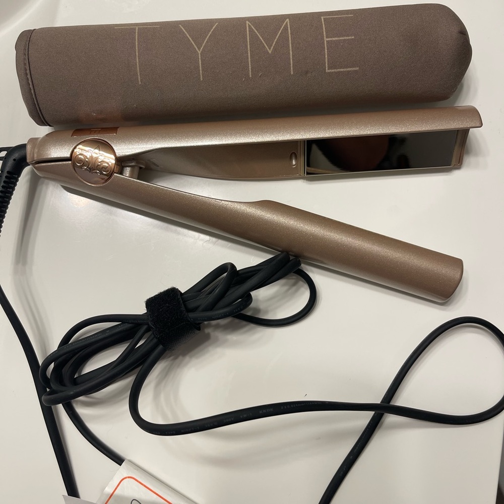 Tyme styling tool. Straightener. Create loose or tight curls.